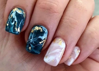 Stylish marble nail art with gold flecks at Beauty Additions, Sandton, Gauteng, ZA.