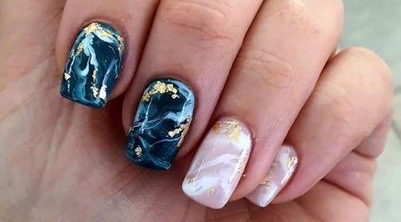 Stylish marble nail art with gold flecks at Beauty Additions, Sandton, Gauteng, ZA.