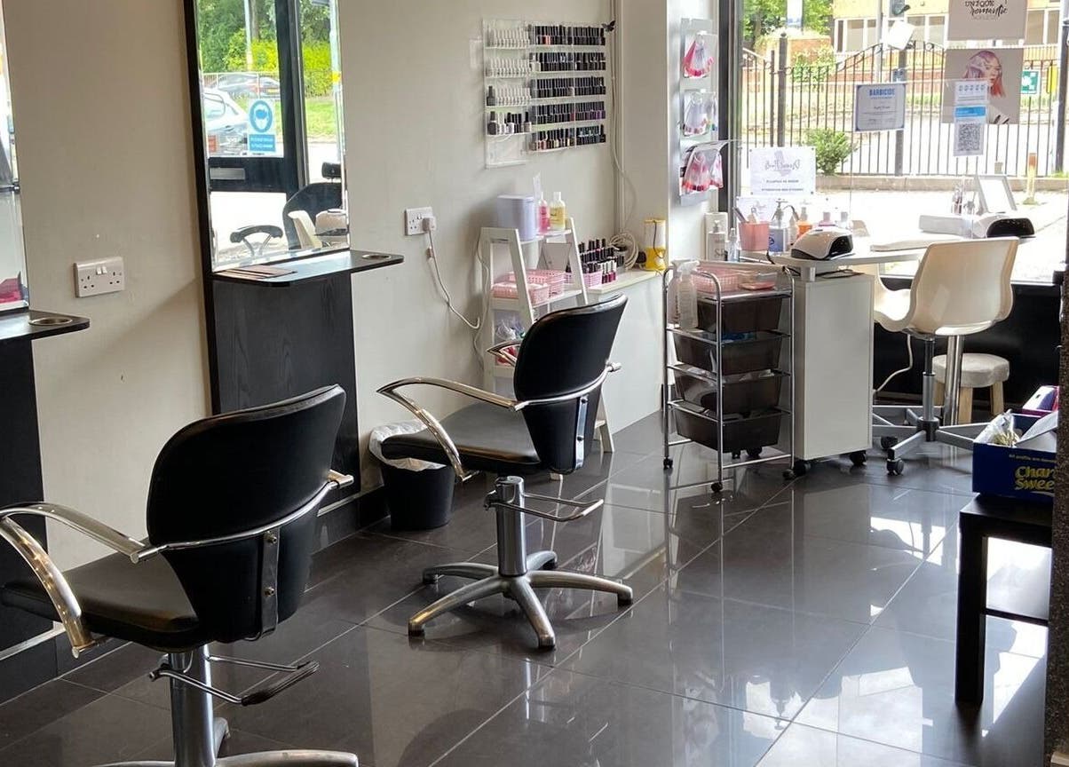 Modern beauty interior at Capellis Birmingham Ltd, Birmingham, England, GB showcases styling chairs and nail art area.