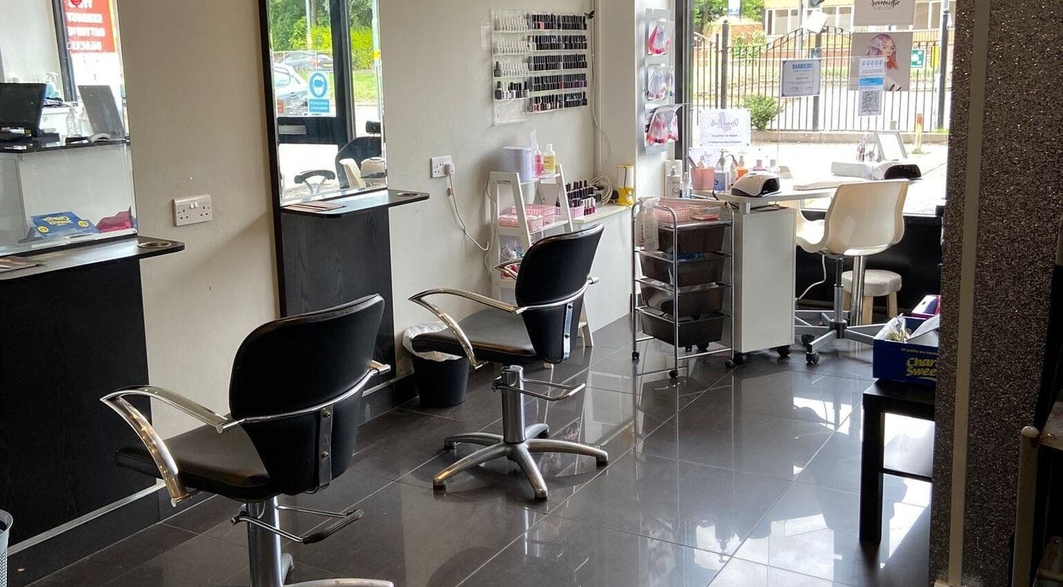 Modern beauty interior at Capellis Birmingham Ltd, Birmingham, England, GB showcases styling chairs and nail art area.