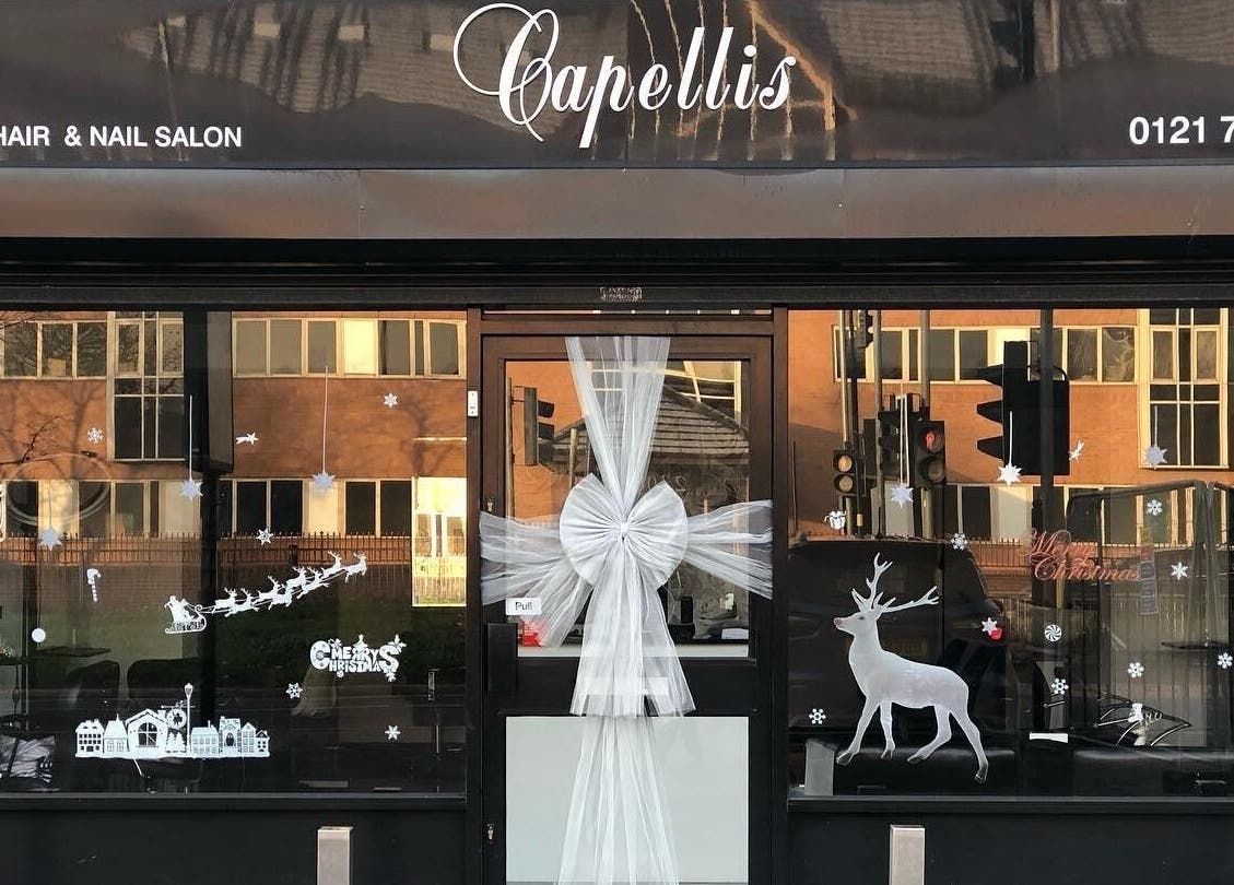 Front view of Capellis Birmingham Ltd in Birmingham, England, GB, decorated festively with white ornaments.