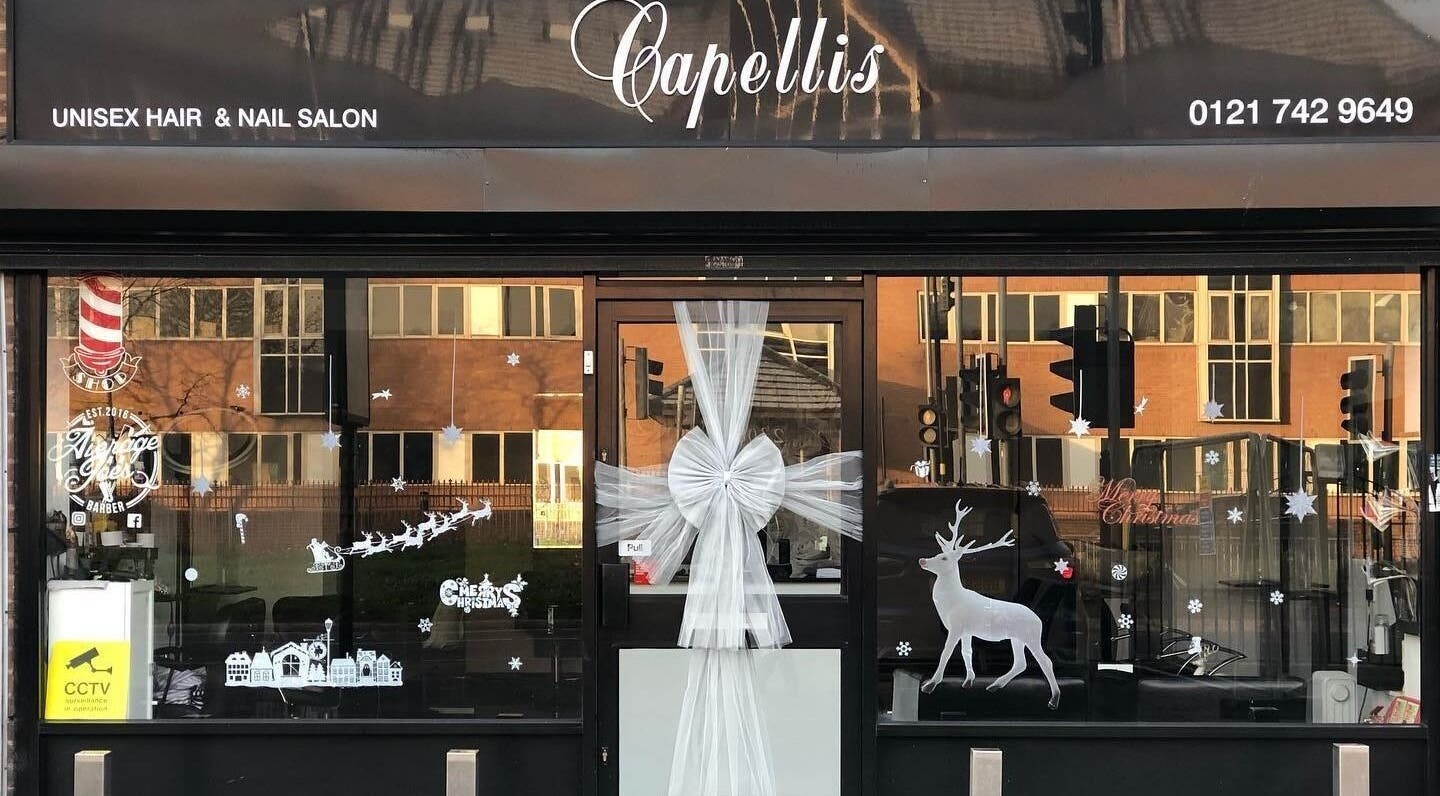 Front view of Capellis Birmingham Ltd in Birmingham, England, GB, decorated festively with white ornaments.