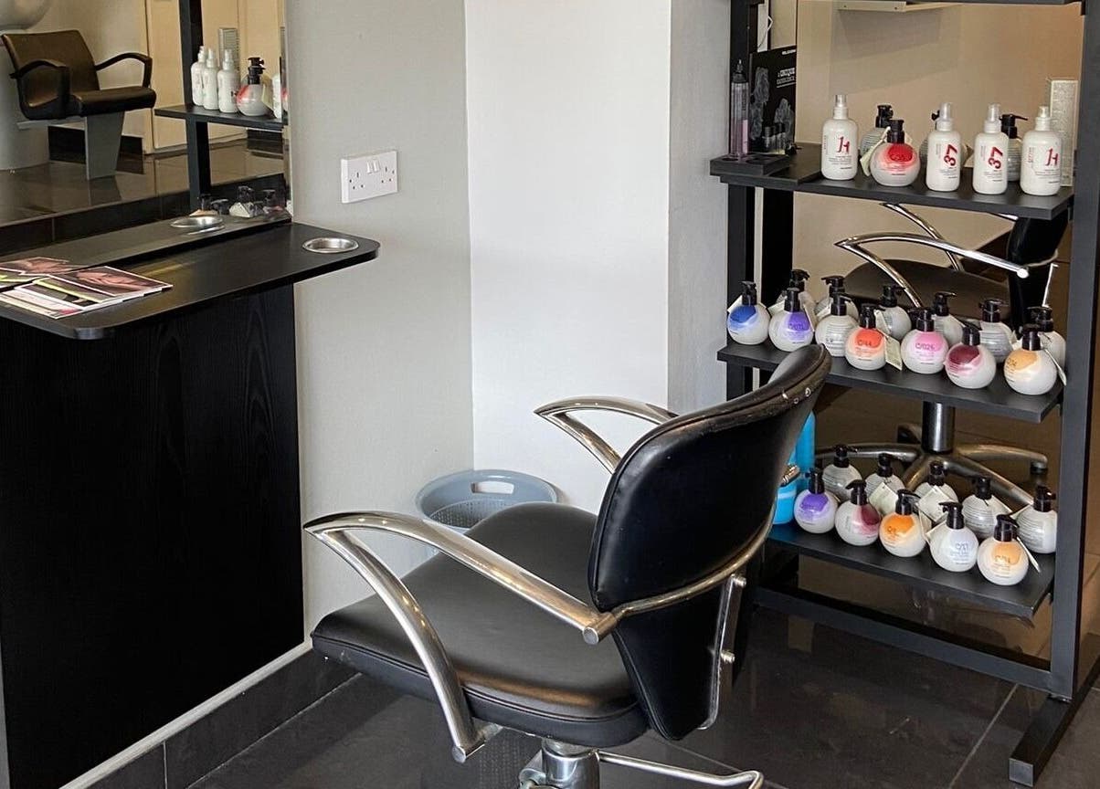 Modern salon chair and product display at Capellis Birmingham Ltd in Birmingham, England, GB.