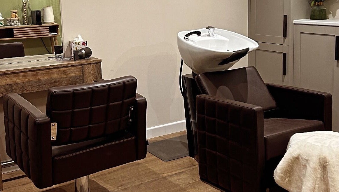 Elegant hair washing and styling area at Salon Megan’s, Surrey, England, GB.