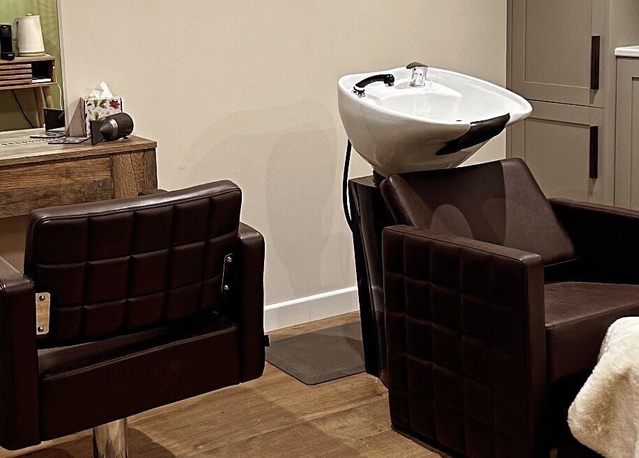 Elegant hair washing and styling area at Salon Megan’s, Surrey, England, GB.