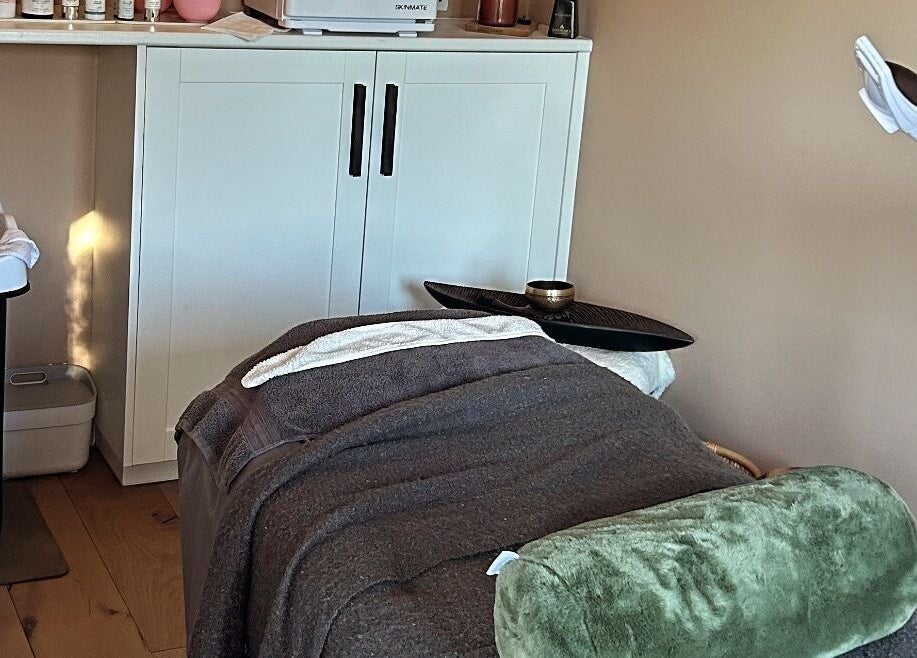 Tranquil treatment room with plush bed at Salon Megan’s, Surrey, England, GB for ultimate wellness experience.