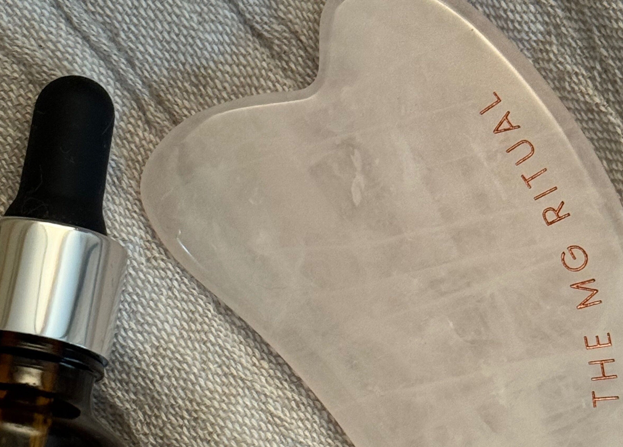 A facial serum and gua sha stone at Salon Megan’s in Surrey, England, GB, perfect for a rejuvenating ritual.