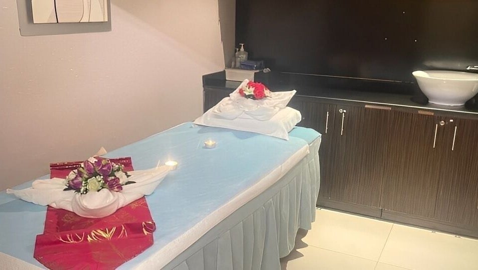 Tranquil treatment room at Body Sky Massage & Spa JLT - Cluster U, Dubai, Dubai, AE with decorated massage bed.