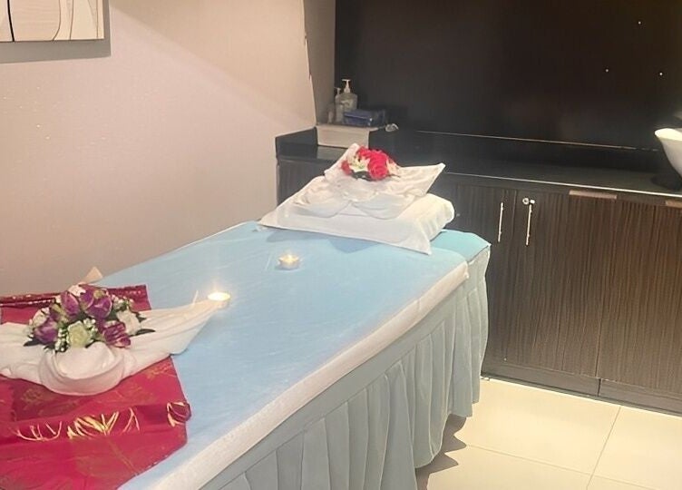 Tranquil treatment room at Body Sky Massage & Spa JLT - Cluster U, Dubai, Dubai, AE with decorated massage bed.