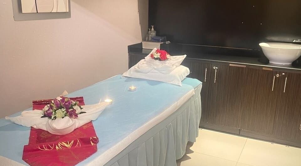 Tranquil treatment room at Body Sky Massage & Spa JLT - Cluster U, Dubai, Dubai, AE with decorated massage bed.