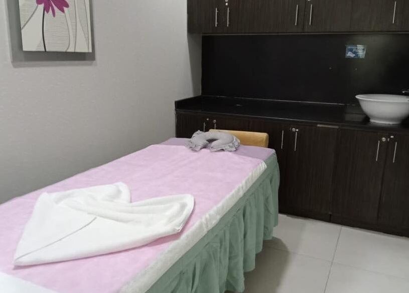 Massage room at Body Sky Massage & Spa JLT - Cluster W, Dubai, AE, featuring a comfortable bed and tranquil decor.