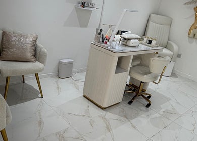 Luxurious nail station at Dolly Rocks Beauty, Aesthetics & Laser, Gorseinon, Wales, GB with plush seating.