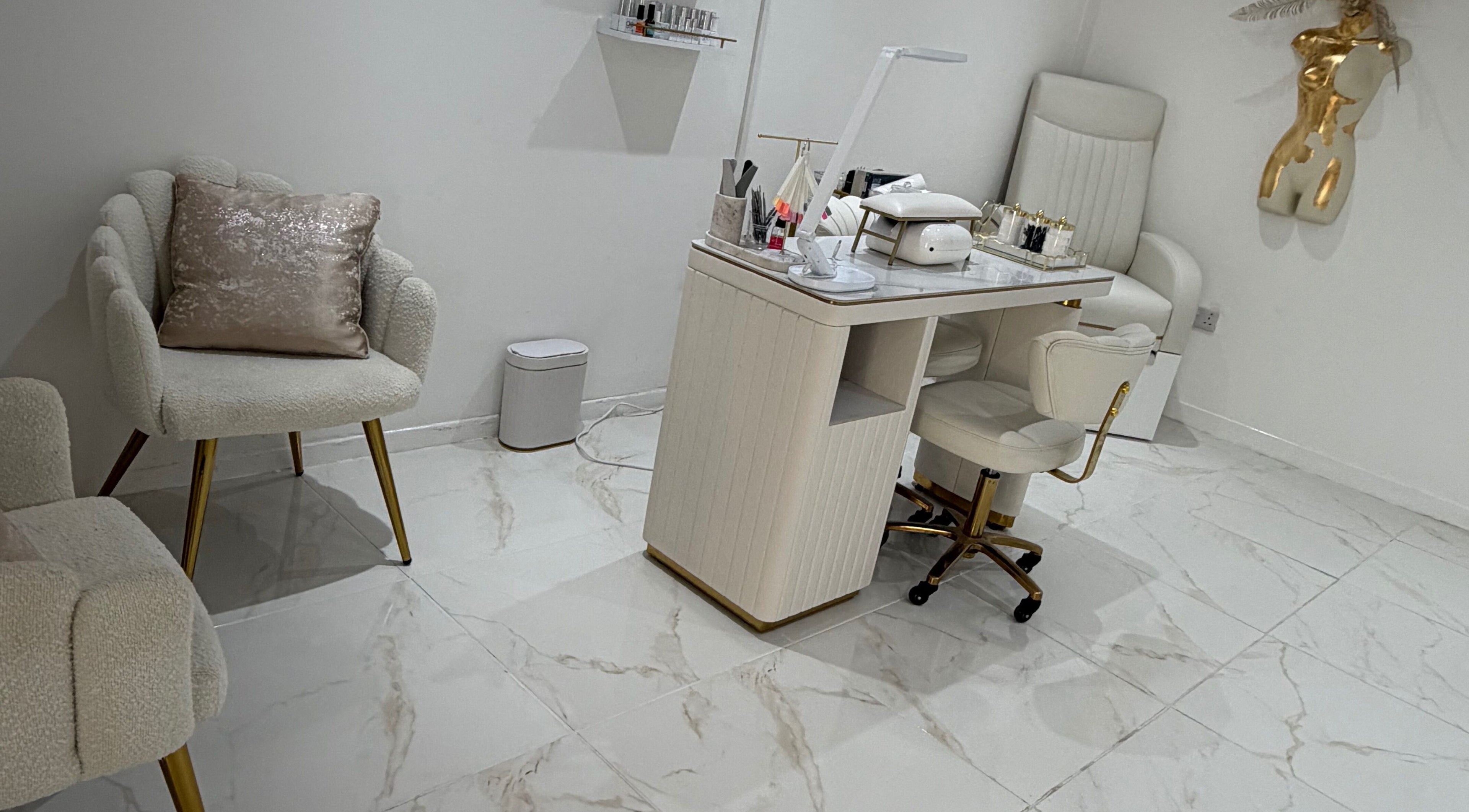 Luxurious nail station at Dolly Rocks Beauty, Aesthetics & Laser, Gorseinon, Wales, GB with plush seating.