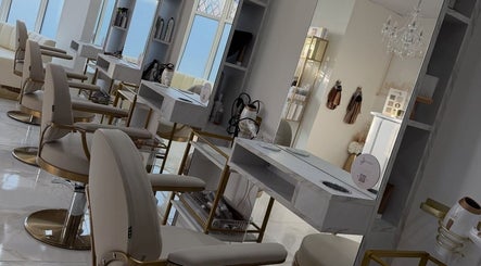 Chic interior at Dolly Rocks Beauty, Aesthetics & Laser in Gorseinon, Wales, GB featuring stylish chairs and mirrors.