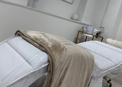 Luxurious treatment beds at Dolly Rocks Beauty, Aesthetics & Laser, Gorseinon, Wales, GB, offering relaxation.