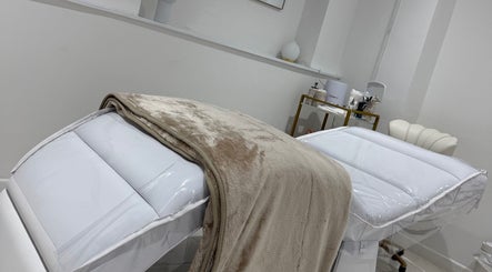 Luxurious treatment beds at Dolly Rocks Beauty, Aesthetics & Laser, Gorseinon, Wales, GB, offering relaxation.