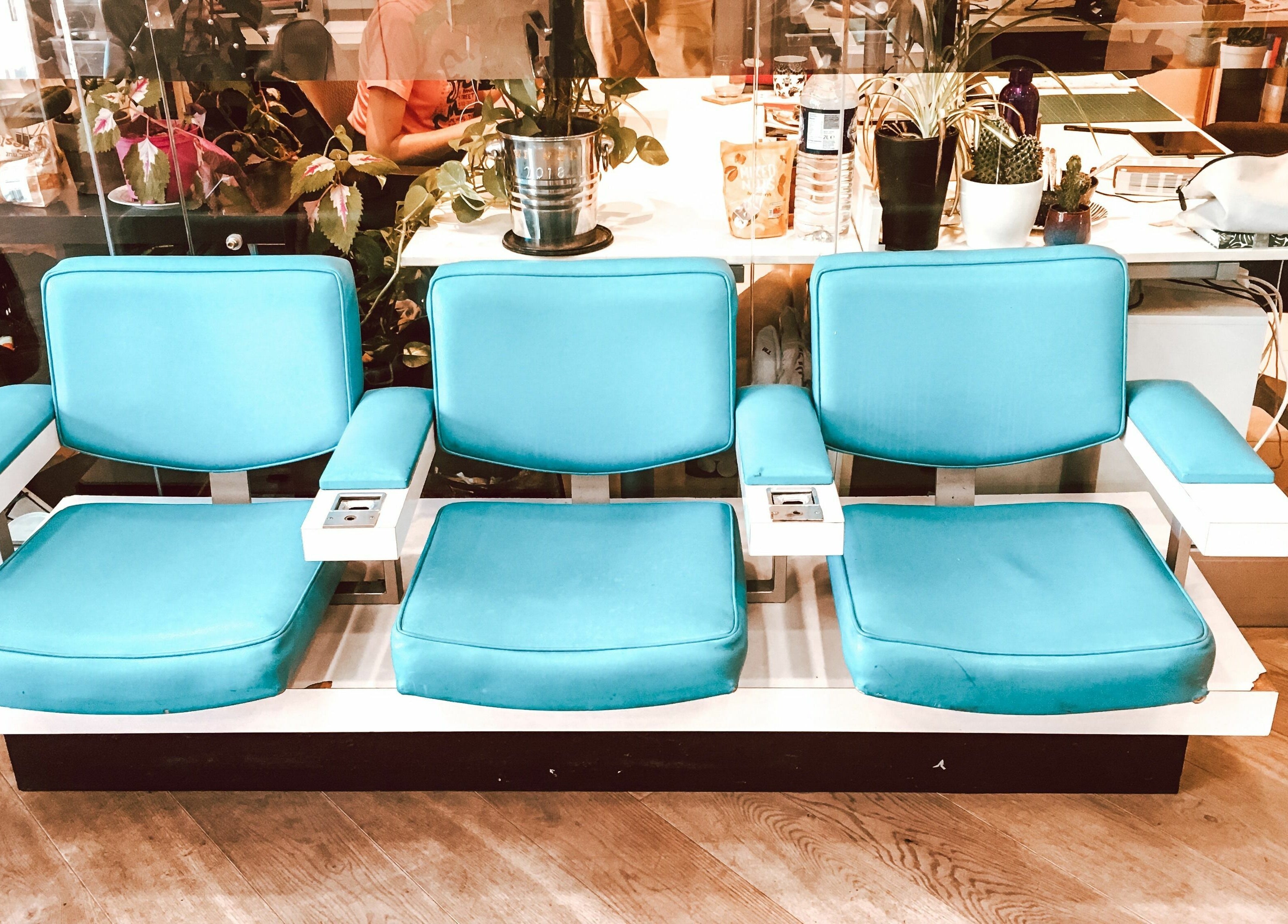 Turquoise salon chairs at Hackney Style Council in London, England. A chic space with a modern vibe.