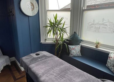 Peaceful massage room at Rejuvenate Massage Therapy, Larne, Northern Ireland, GB with soothing decor.