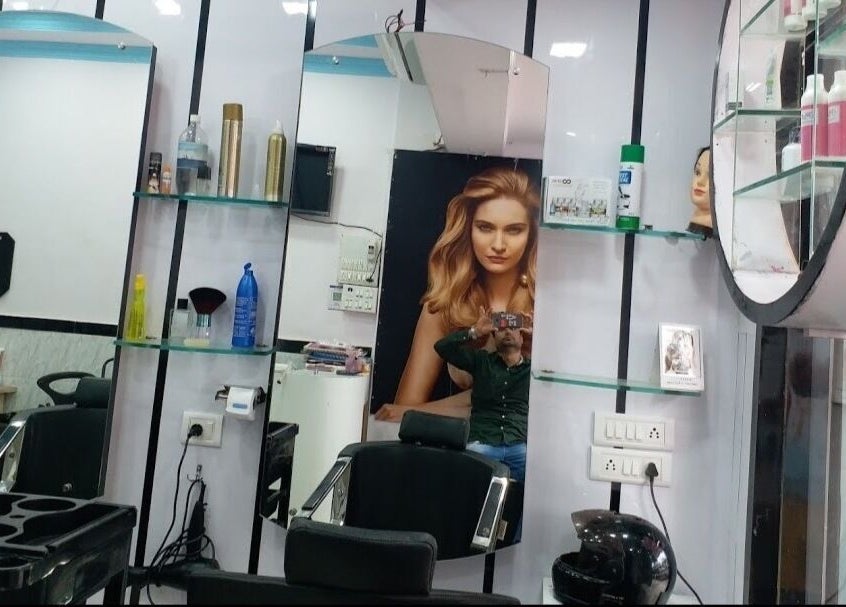 Interior of Milon Salon in Mumbai, Maharashtra, IN showing a modern salon setup with products and styling chairs.
