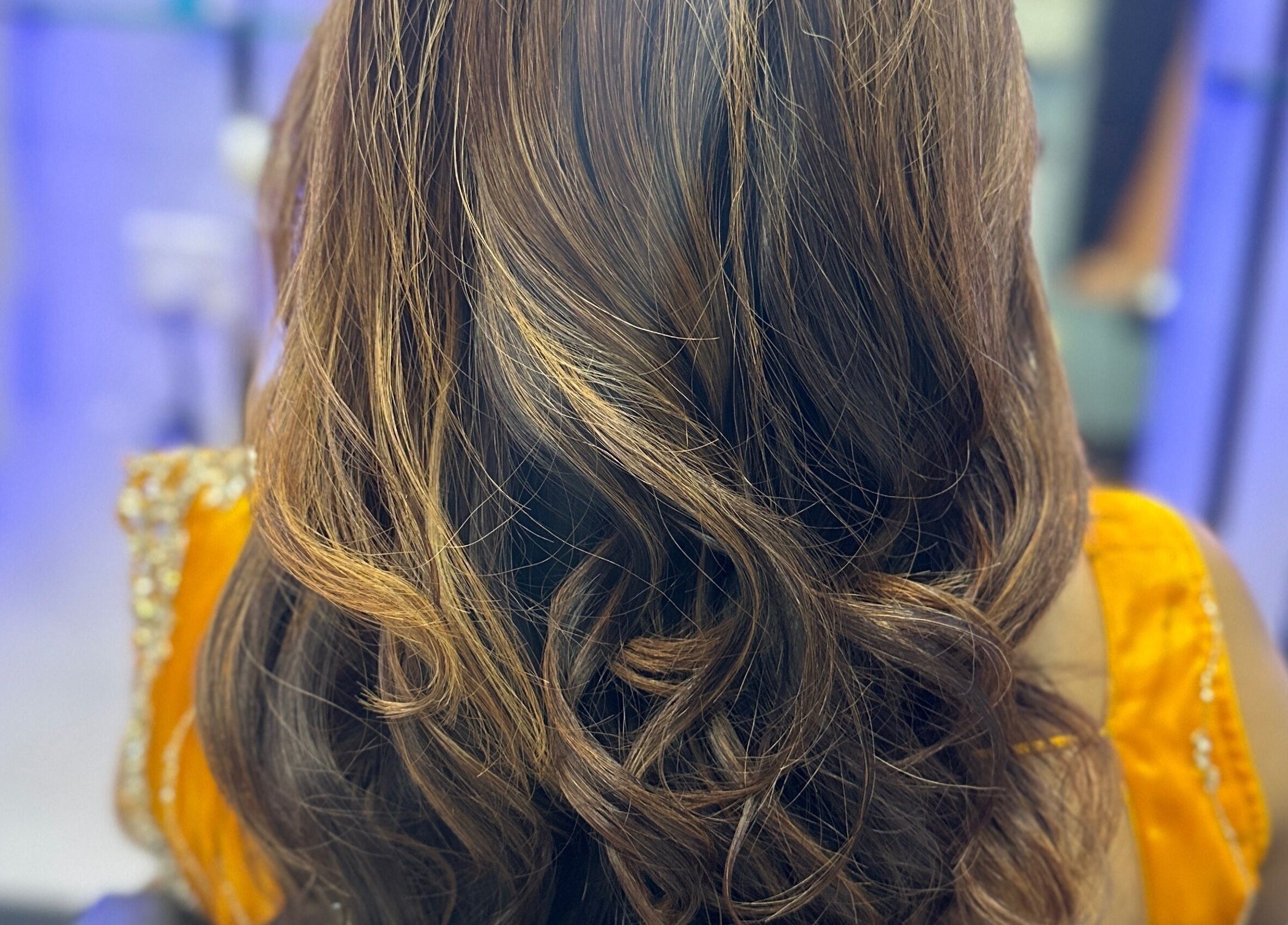 Exquisite wavy hairstyle at Milon Salon, Mumbai, Maharashtra, IN. Perfect for enhancing beauty and style.