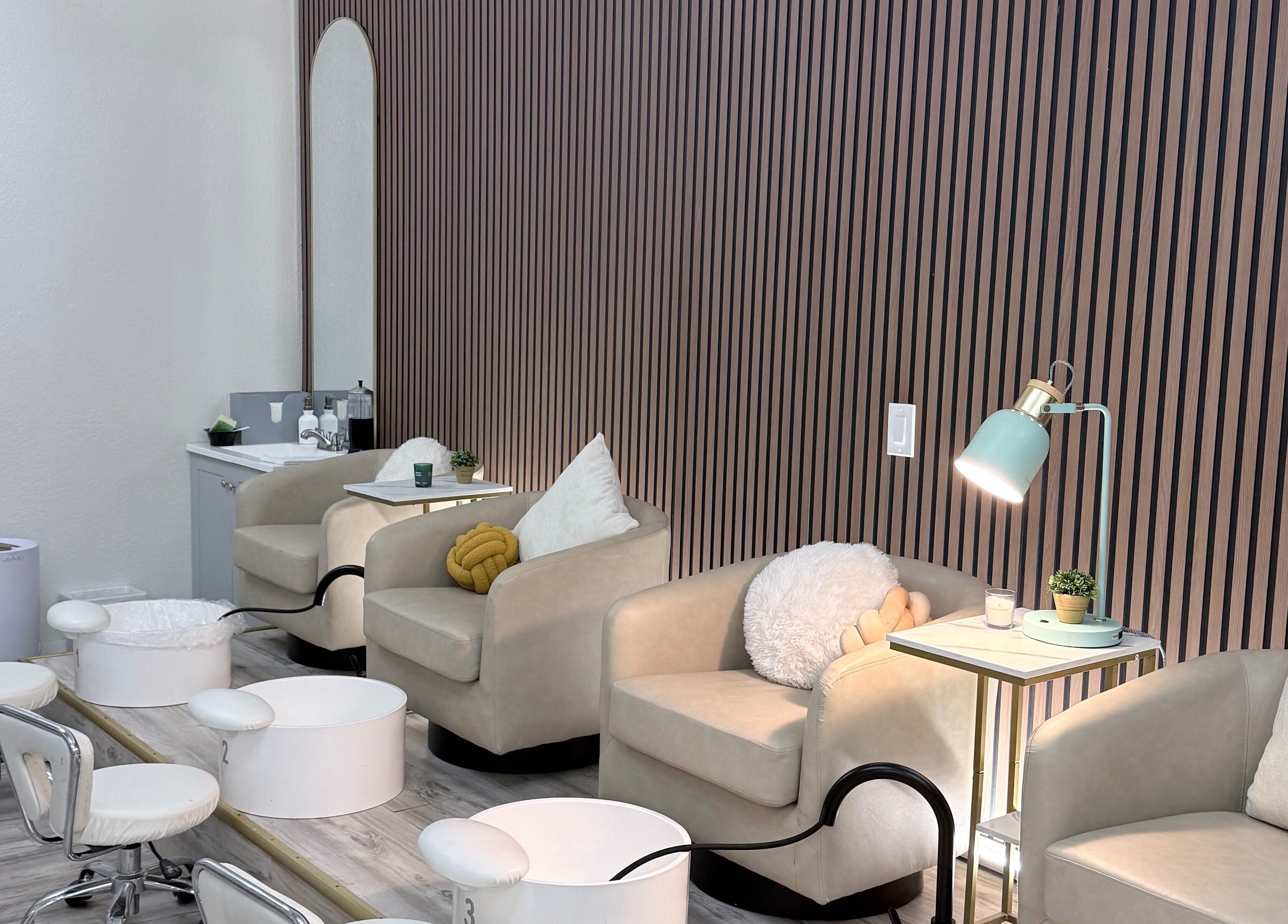 Elegant seating area at Me Nail Spa, Alameda, California, US, featuring plush chairs and modern decor.