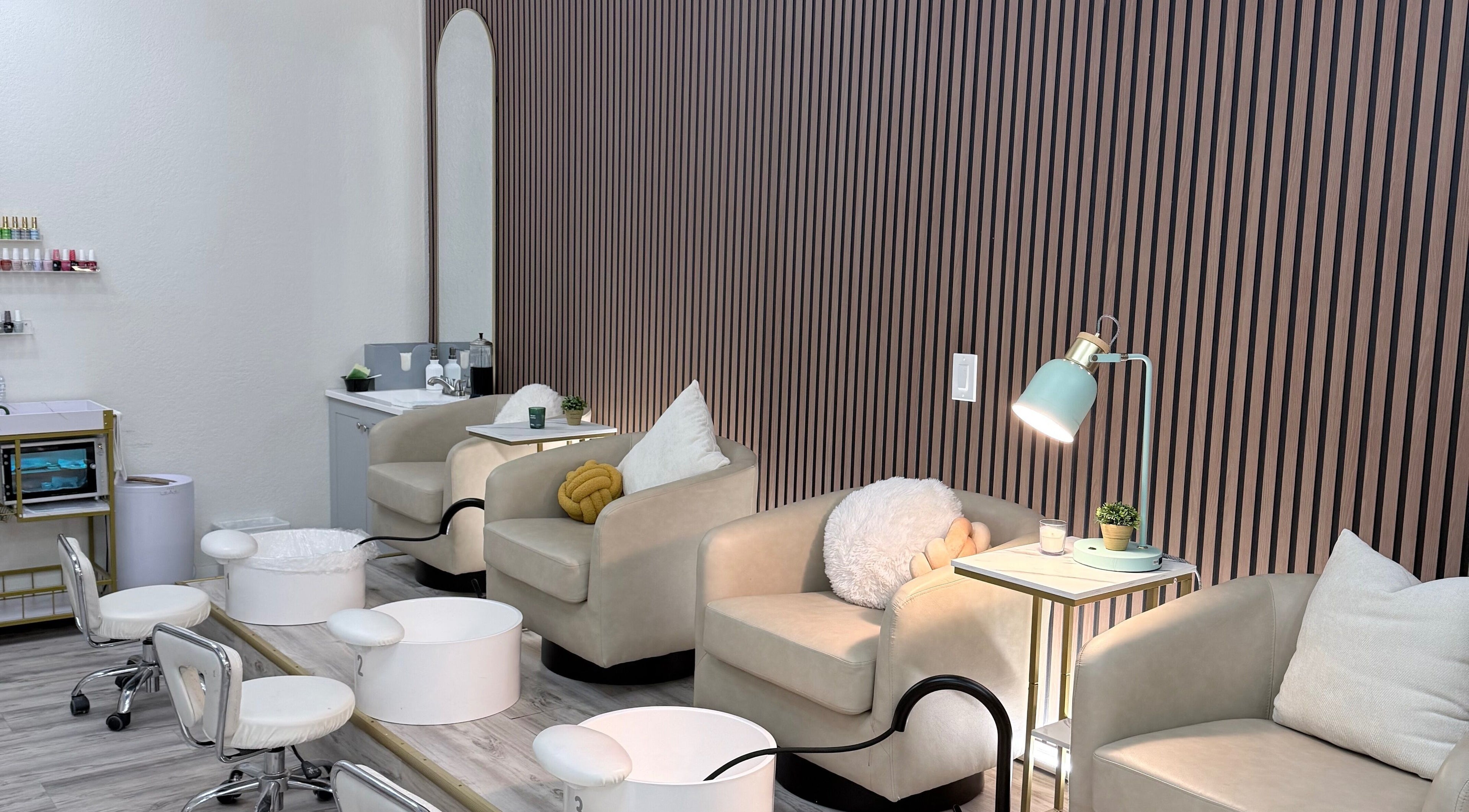 Elegant seating area at Me Nail Spa, Alameda, California, US, featuring plush chairs and modern decor.