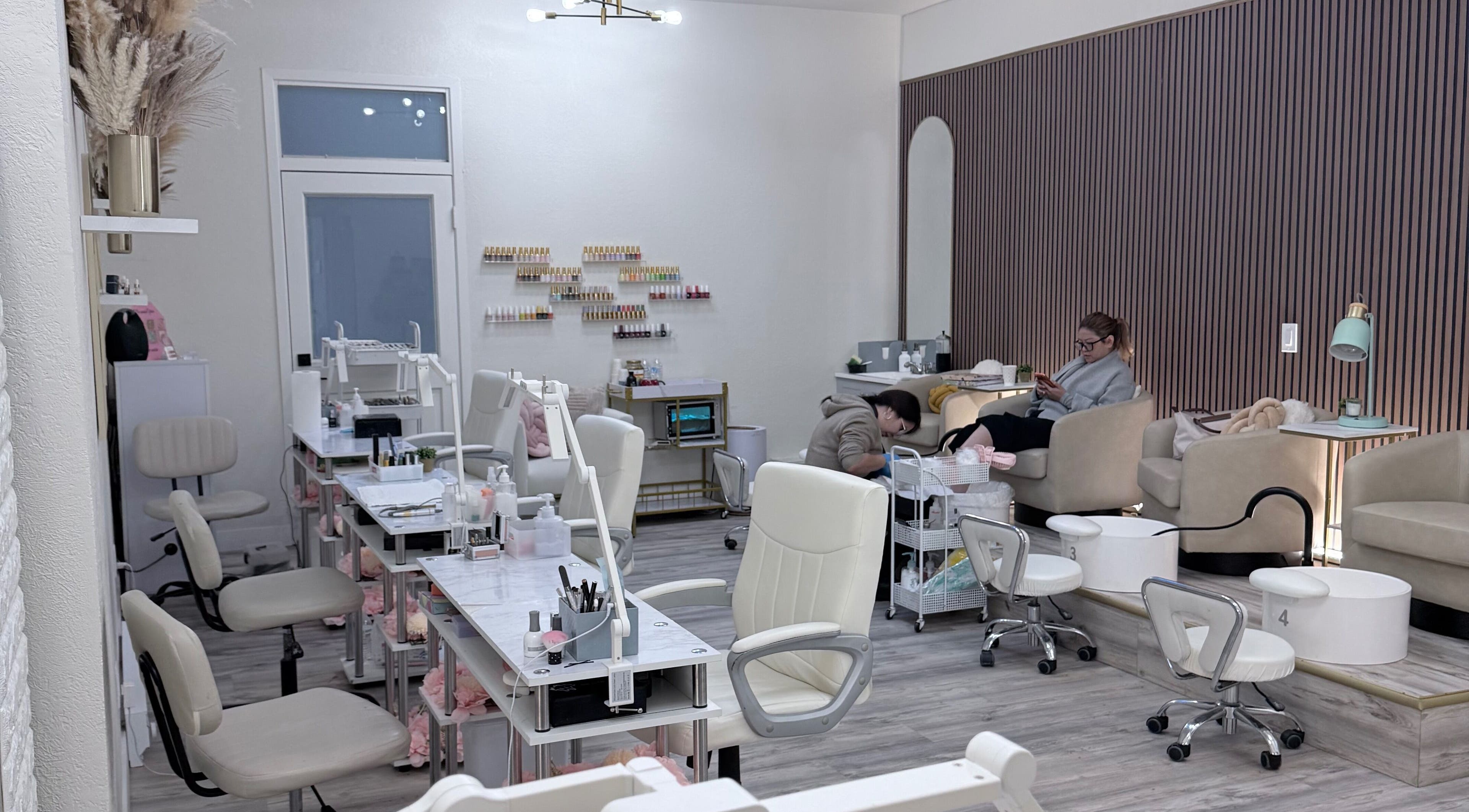 Calm interior of Me Nail Spa in Alameda, California, US showing modern nail stations and relaxing chairs.