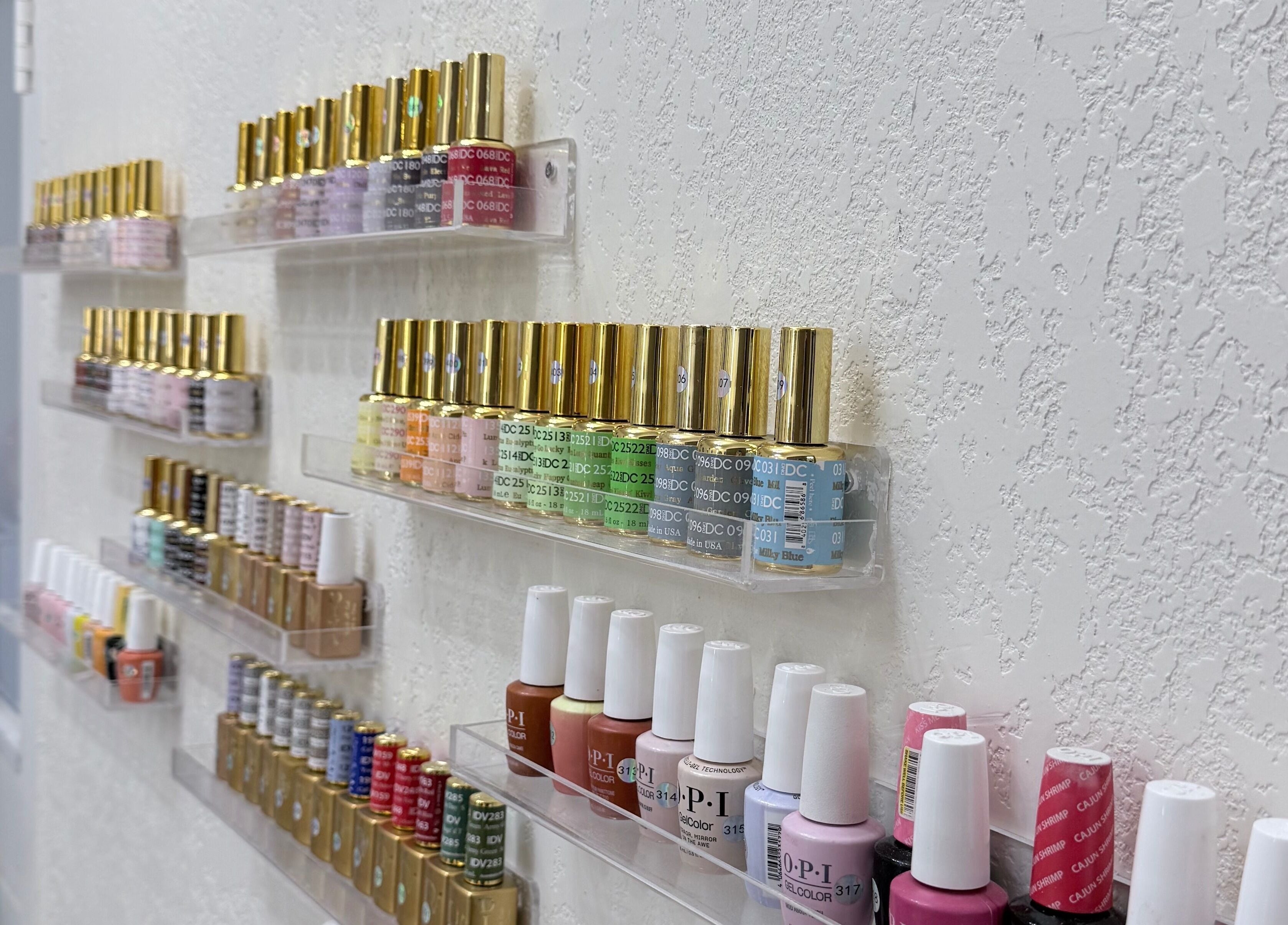 Vibrant nail polish display at Me Nail Spa, Alameda, California, US showcasing diverse colors.