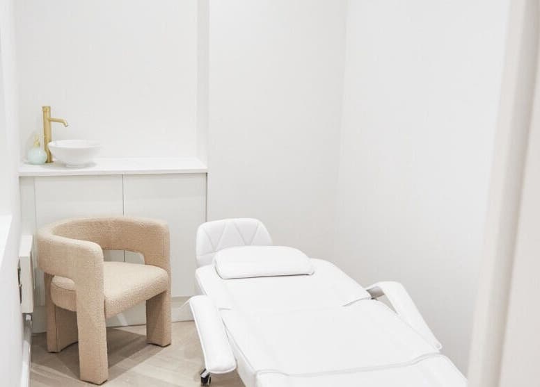 Luxury treatment room at Allure - Jesmond, Newcastle upon Tyne, England, GB with modern decor and plush seating.