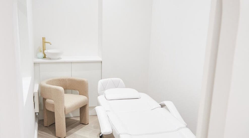 Luxury treatment room at Allure - Jesmond, Newcastle upon Tyne, England, GB with modern decor and plush seating.