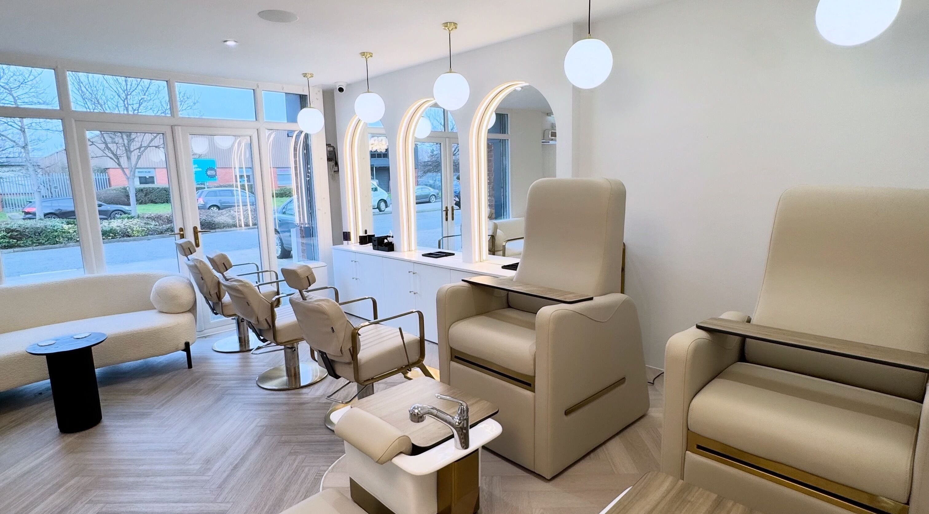 Elegant interior of Allure - Hebburn salon in Hebburn, England, GB with stylish chairs and mirrors.