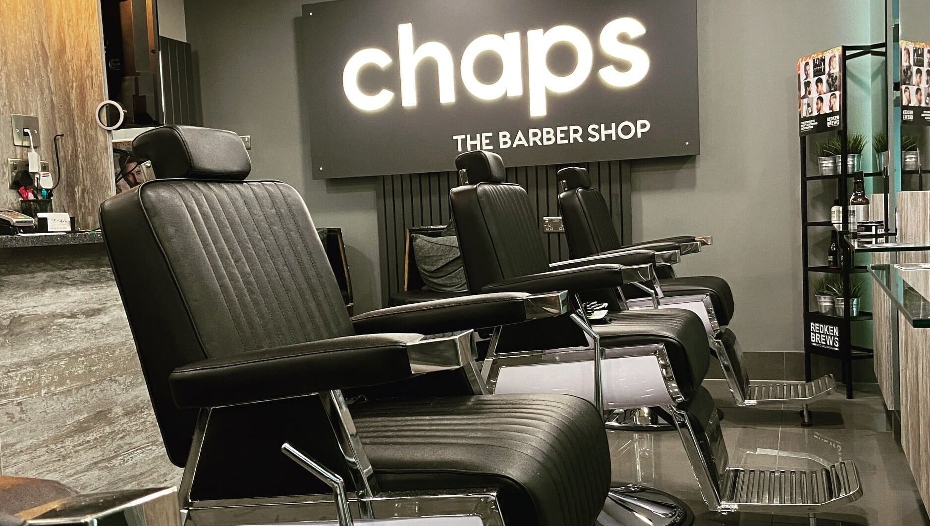 Modern barber chairs at Chaps The Barbershop in Edinburgh, Scotland, GB reflecting sleek design and comfort.