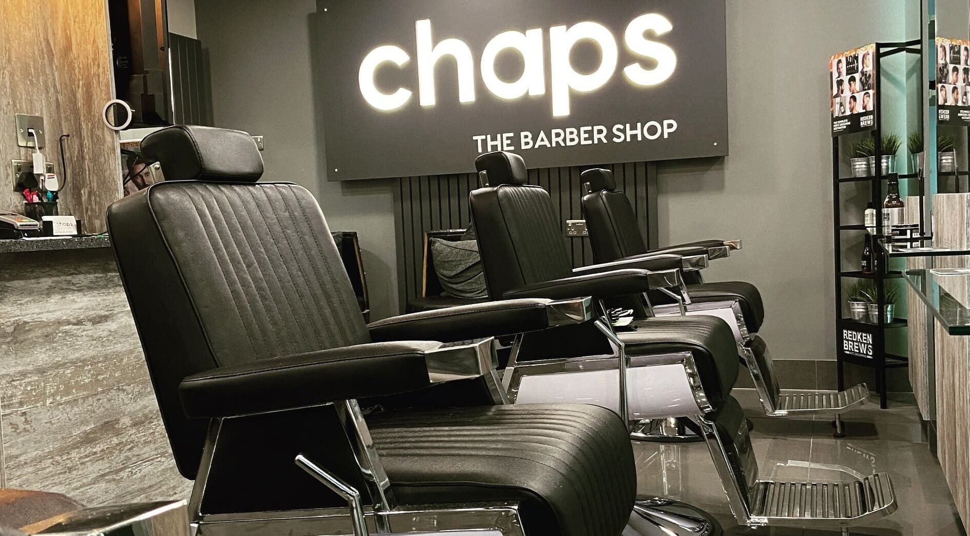 Modern barber chairs at Chaps The Barbershop in Edinburgh, Scotland, GB reflecting sleek design and comfort.
