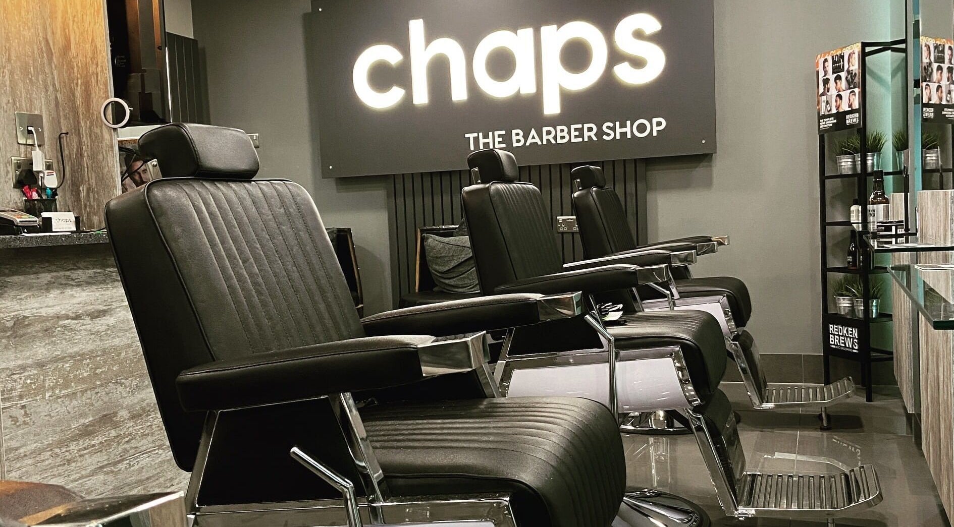 Modern barber chairs at Chaps The Barbershop in Edinburgh, Scotland, GB reflecting sleek design and comfort.