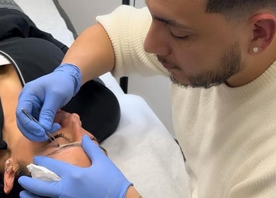 Expert applying precision eyebrow treatment at The Brow Lounge, El Paso, Texas, US.
