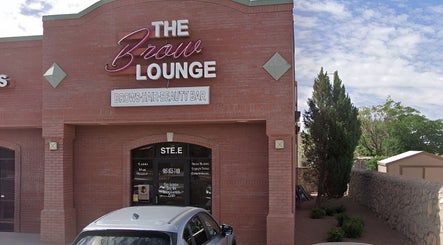 The Brow Lounge entrance in El Paso, Texas, US with red brick exterior and elegant signage.