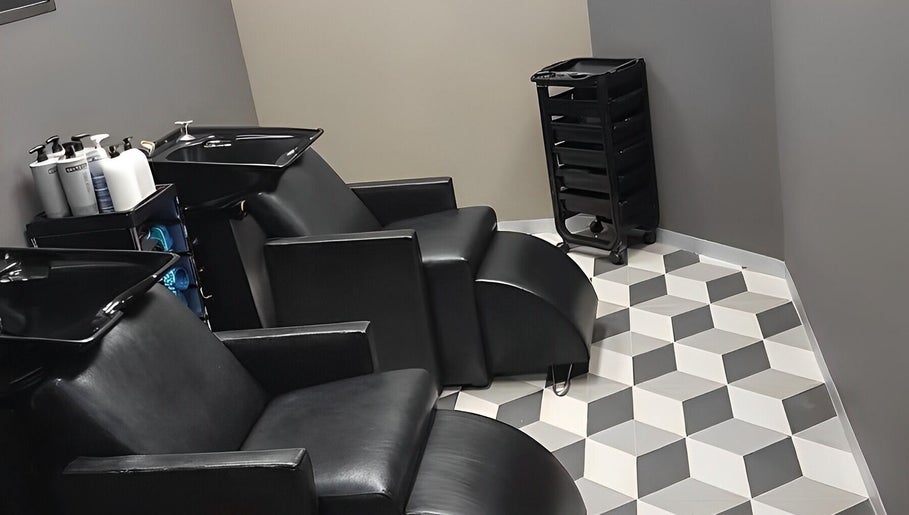 Modern salon chairs and washbasins at The Hair Movement, Durban, KwaZulu-Natal, ZA.