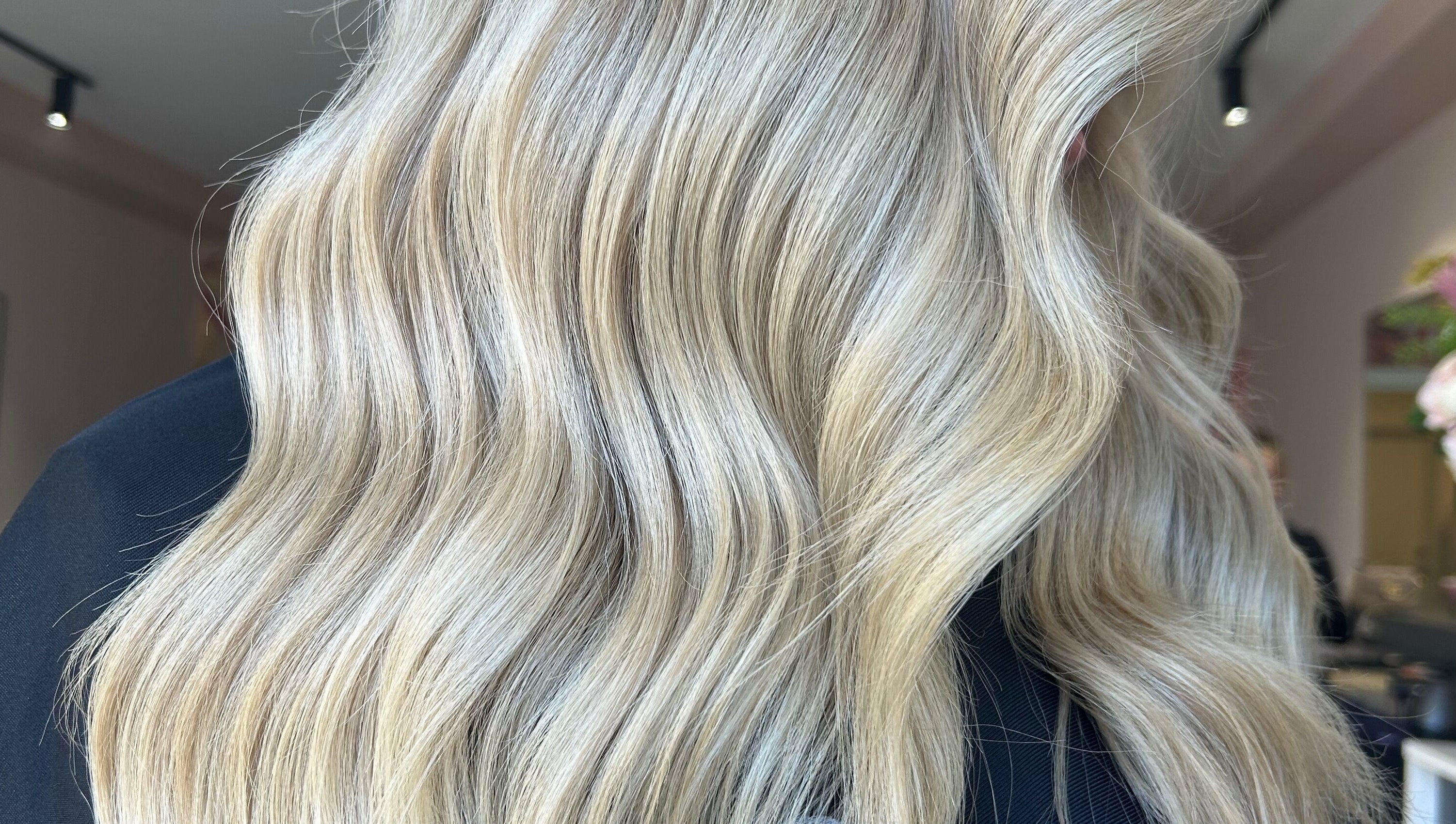 Luxurious blonde hair styled in waves at Hair + Her, Gungahlin, Australian Capital Territory, AU.