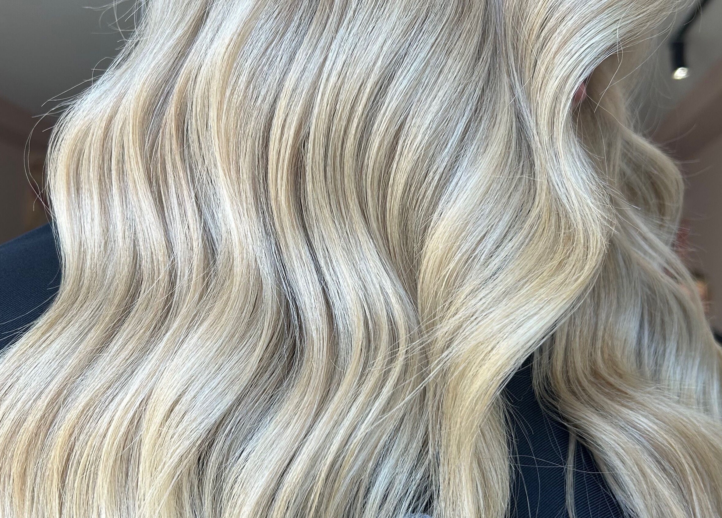Luxurious blonde hair styled in waves at Hair + Her, Gungahlin, Australian Capital Territory, AU.