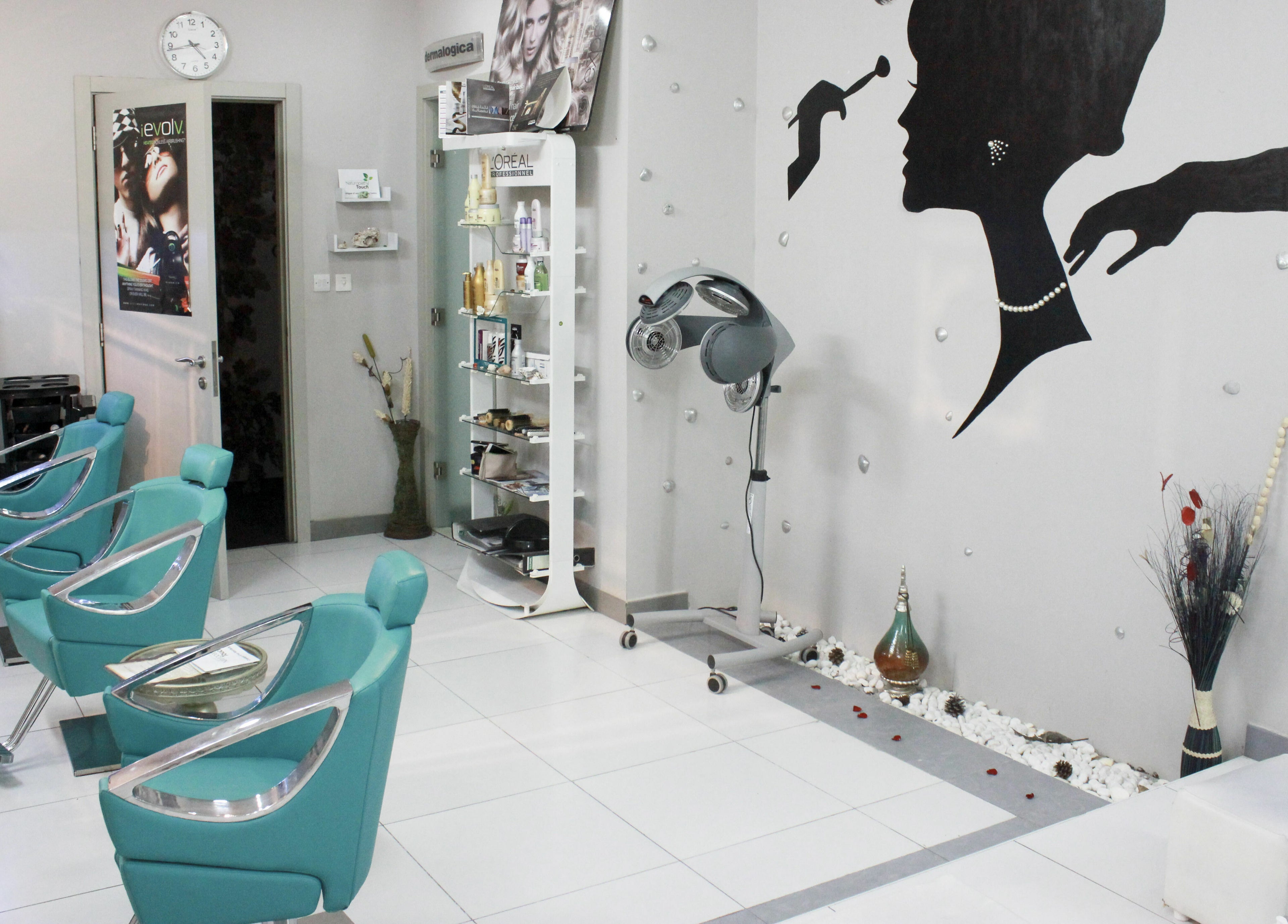 Interior of Naturopathy Touch Cluster D salon in Dubai, AE featuring modern styling chairs and decor.