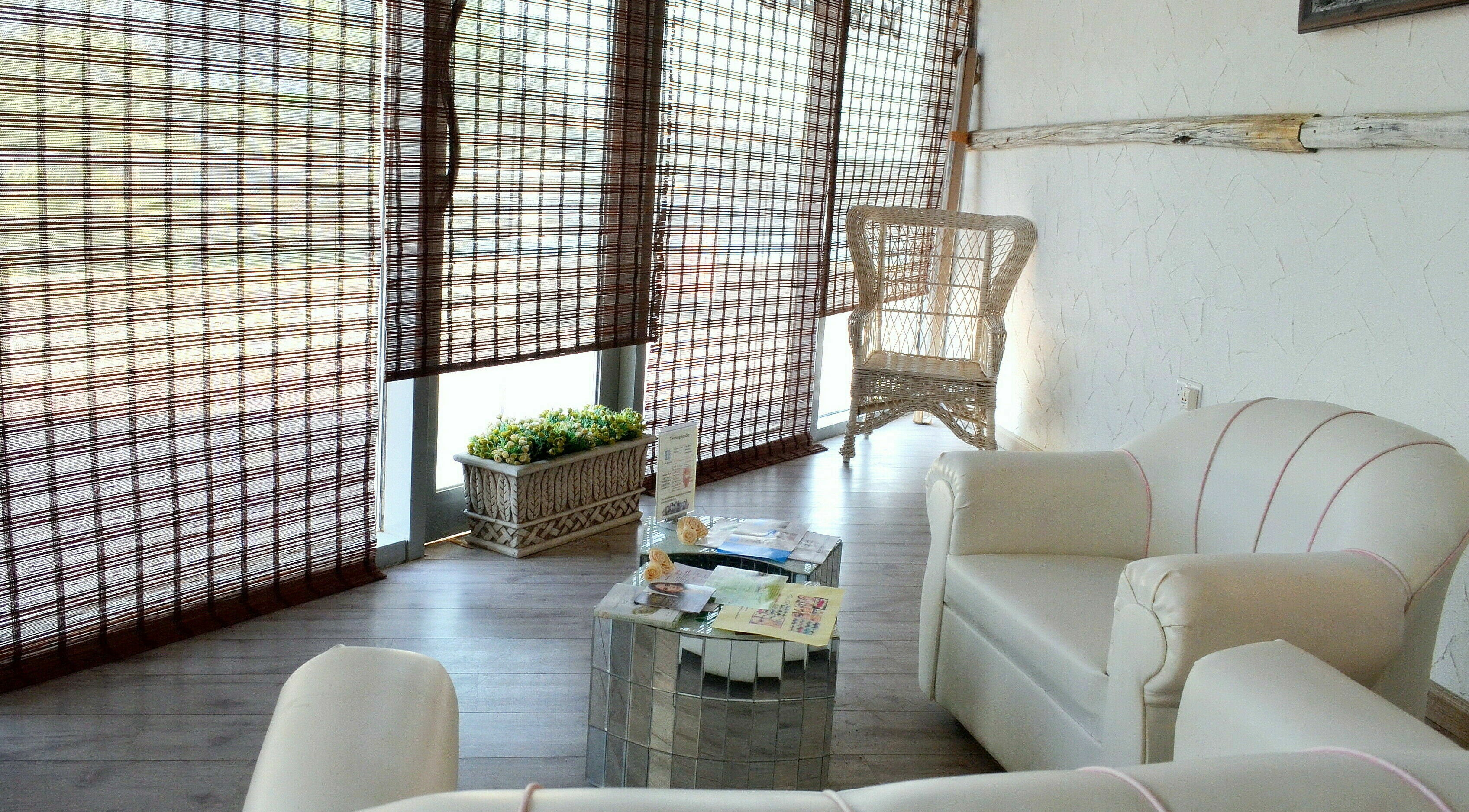 Relaxing lounge area at Naturopathy Touch Cluster D, Dubai, AE with comfortable seating and natural decor.