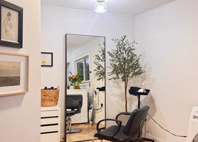 Elegant styling area at Jessica Blackmon - Hairstylist, Langley City, British Columbia, CA featuring decor and seating.