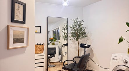 Elegant styling area at Jessica Blackmon - Hairstylist, Langley City, British Columbia, CA featuring decor and seating.