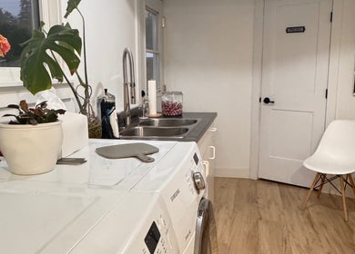 Inviting corner at Jessica Blackmon - Hairstylist, Langley City with plants and seating.