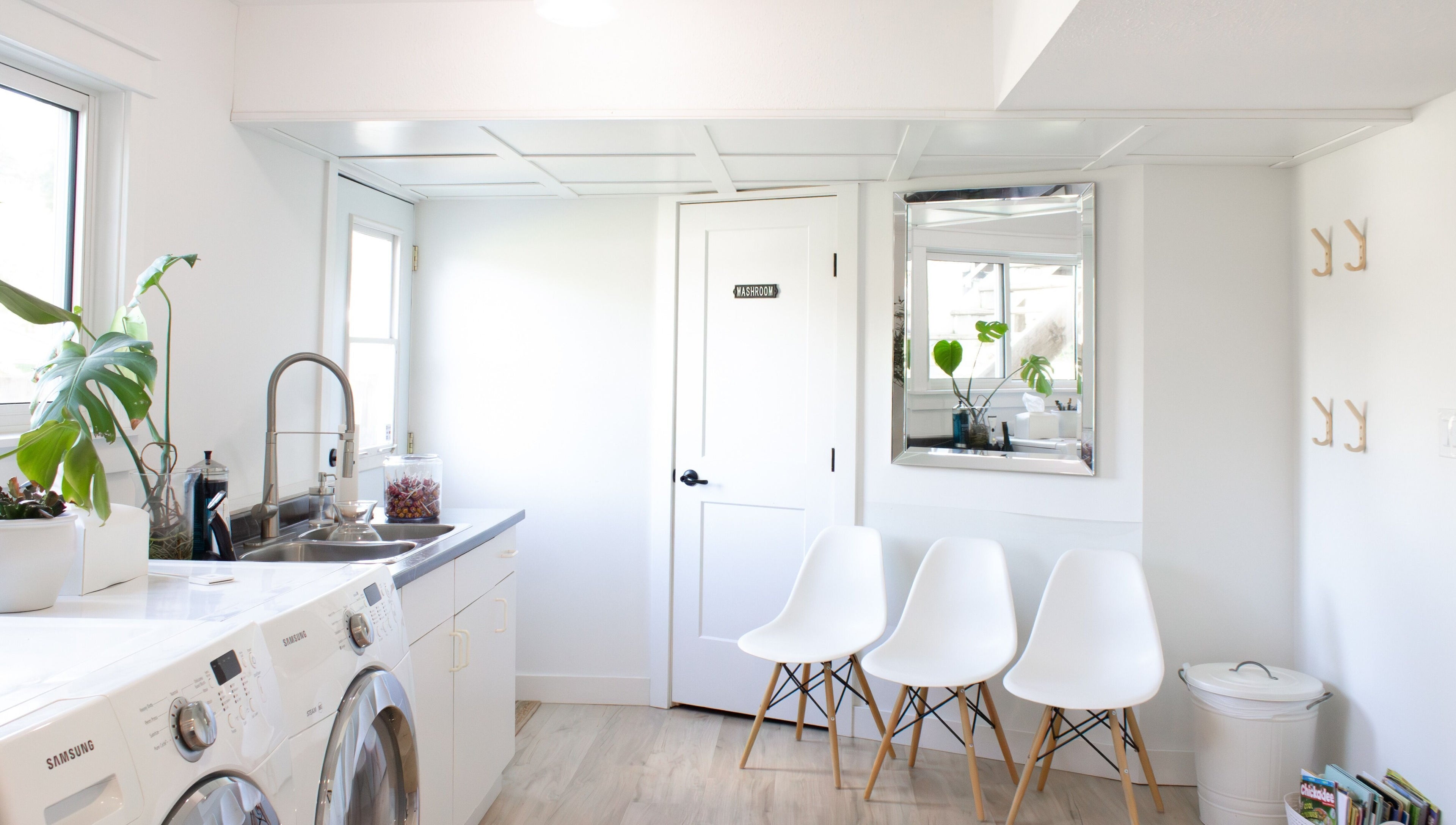 Bright waiting area at Jessica Blackmon - Hairstylist, Langley City, BC, featuring chic chairs and plants.