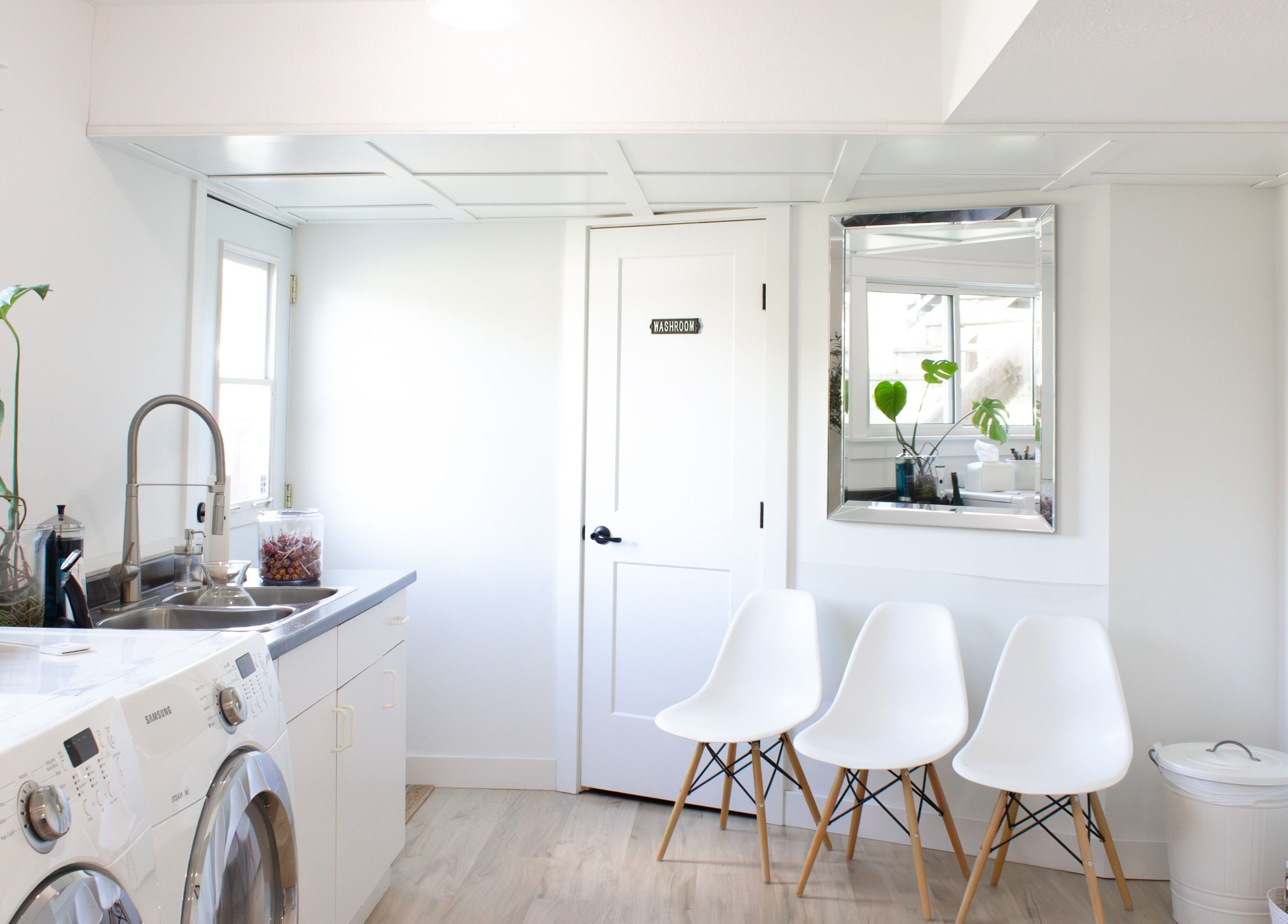 Bright waiting area at Jessica Blackmon - Hairstylist, Langley City, BC, featuring chic chairs and plants.