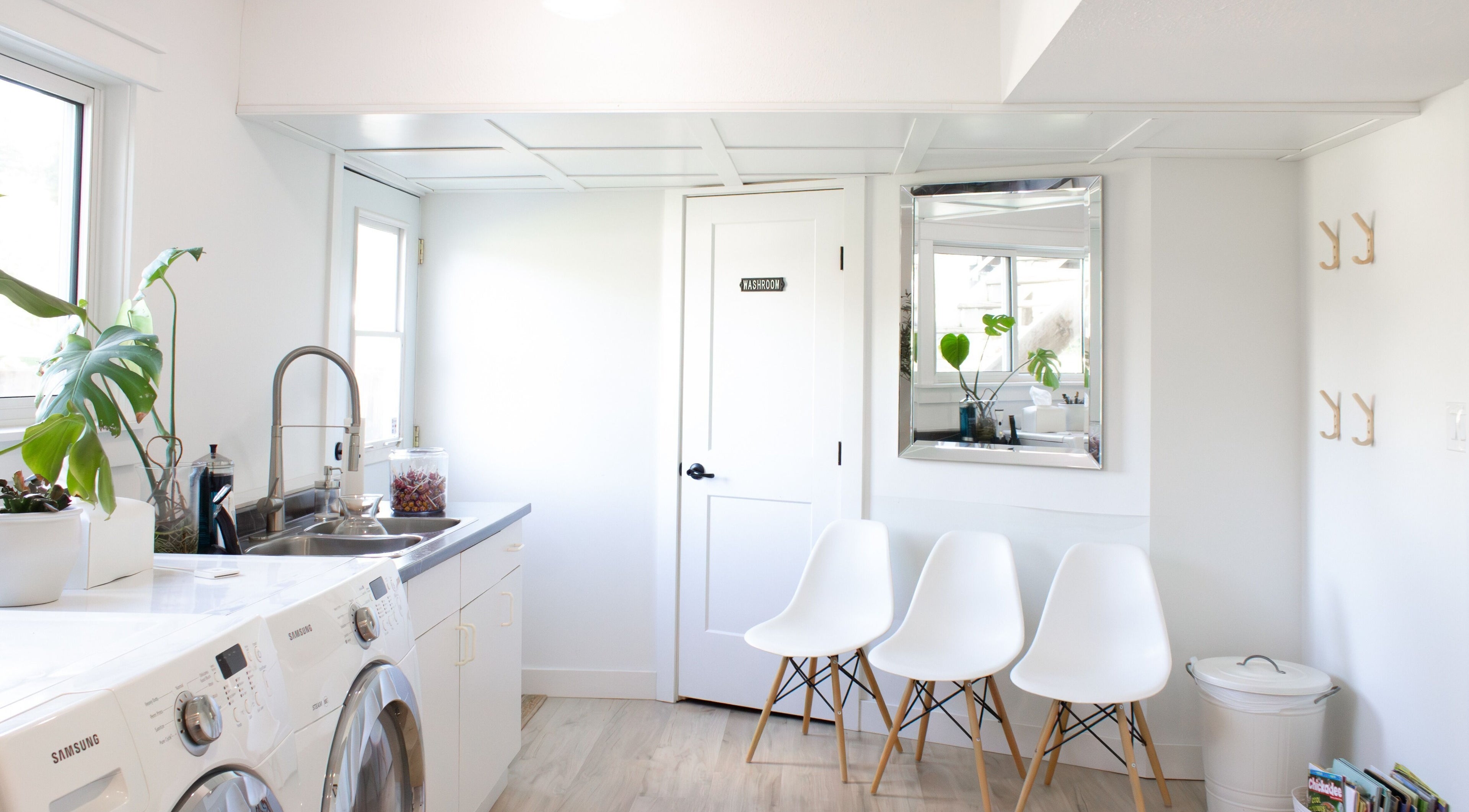 Bright waiting area at Jessica Blackmon - Hairstylist, Langley City, BC, featuring chic chairs and plants.