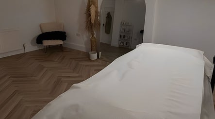 Elegant treatment room at The Facialist Hampshire in Farleigh Wallop, England, GB with calming decor.