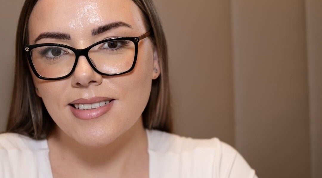 A welcoming smile at The Facialist Hampshire, Farleigh Wallop, England, GB, highlighting a modern beauty ambiance.