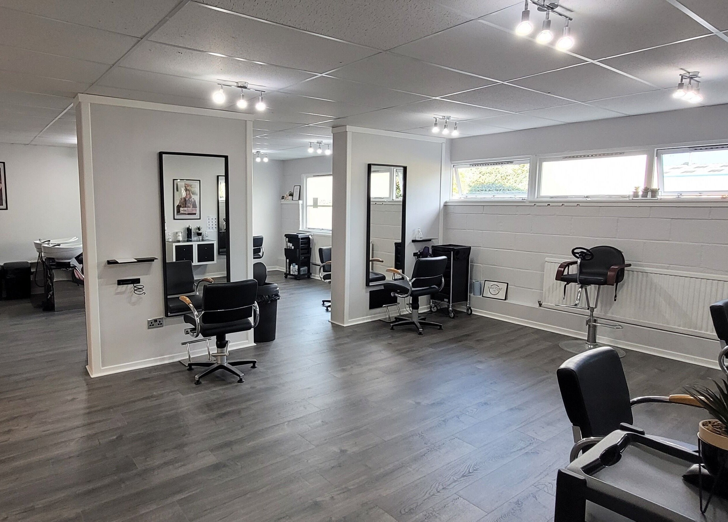 Modern interior of Salon 10, Dalgety Bay, Scotland, GB with sleek chairs and stylish decor.